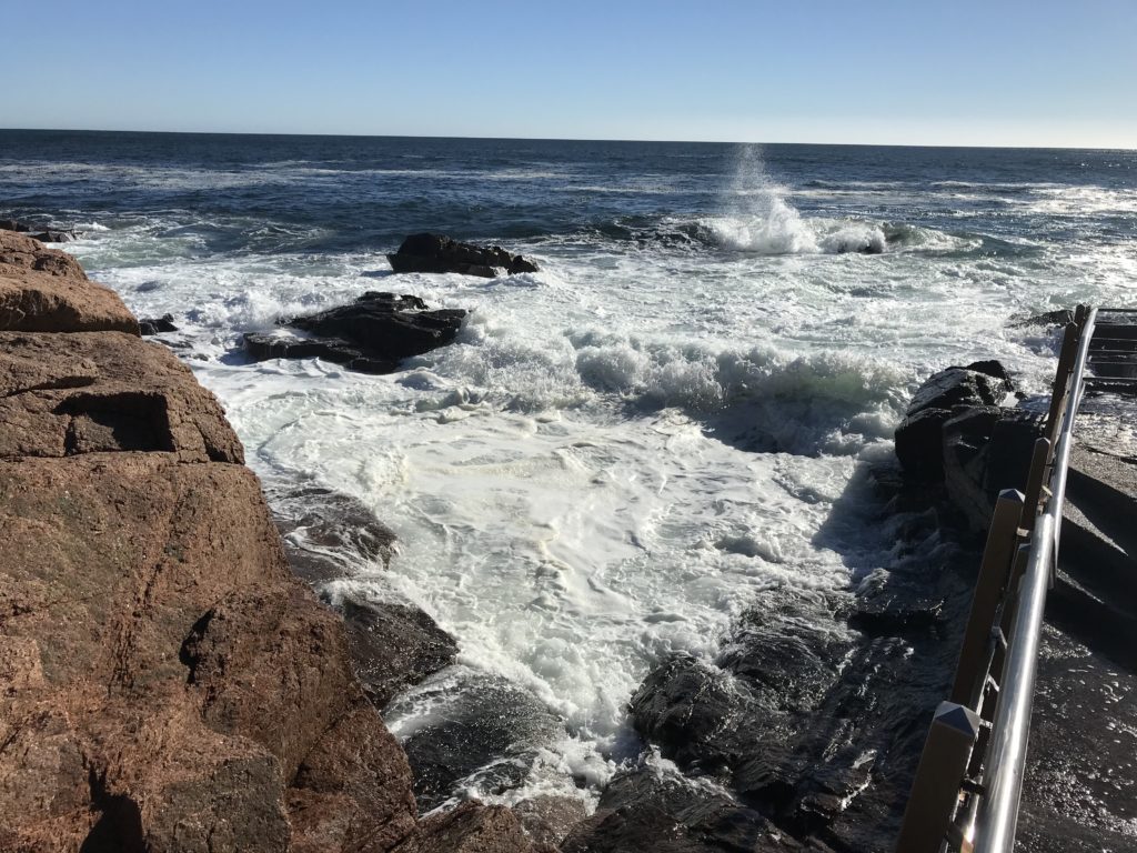 ocean breaking on huge, jagged rocks